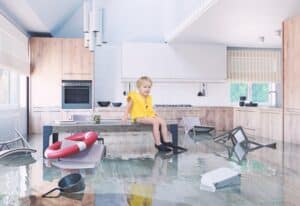Boy,Playing,On,Table,While,Flooding,In,The,Kitchen ,Media