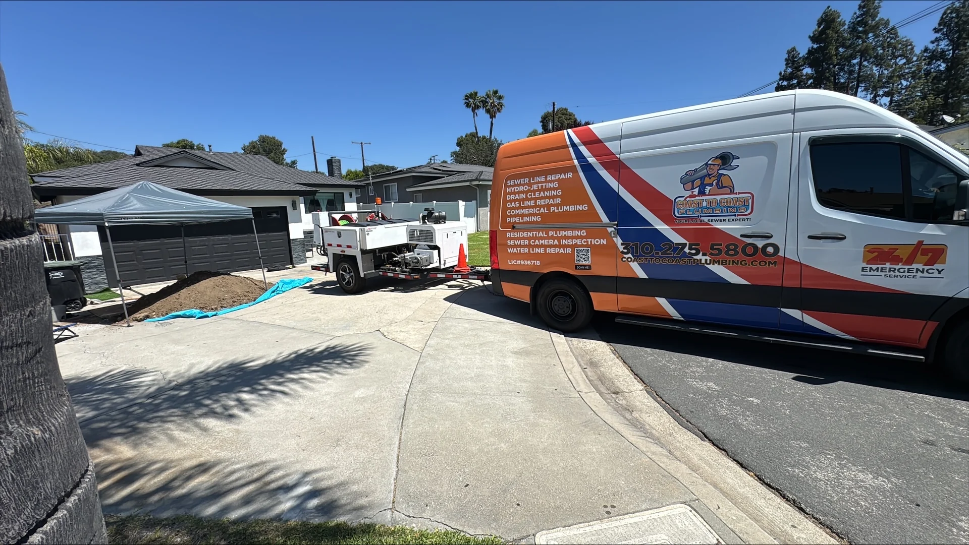 Coast to Coast branded van and service equipment at a job site.